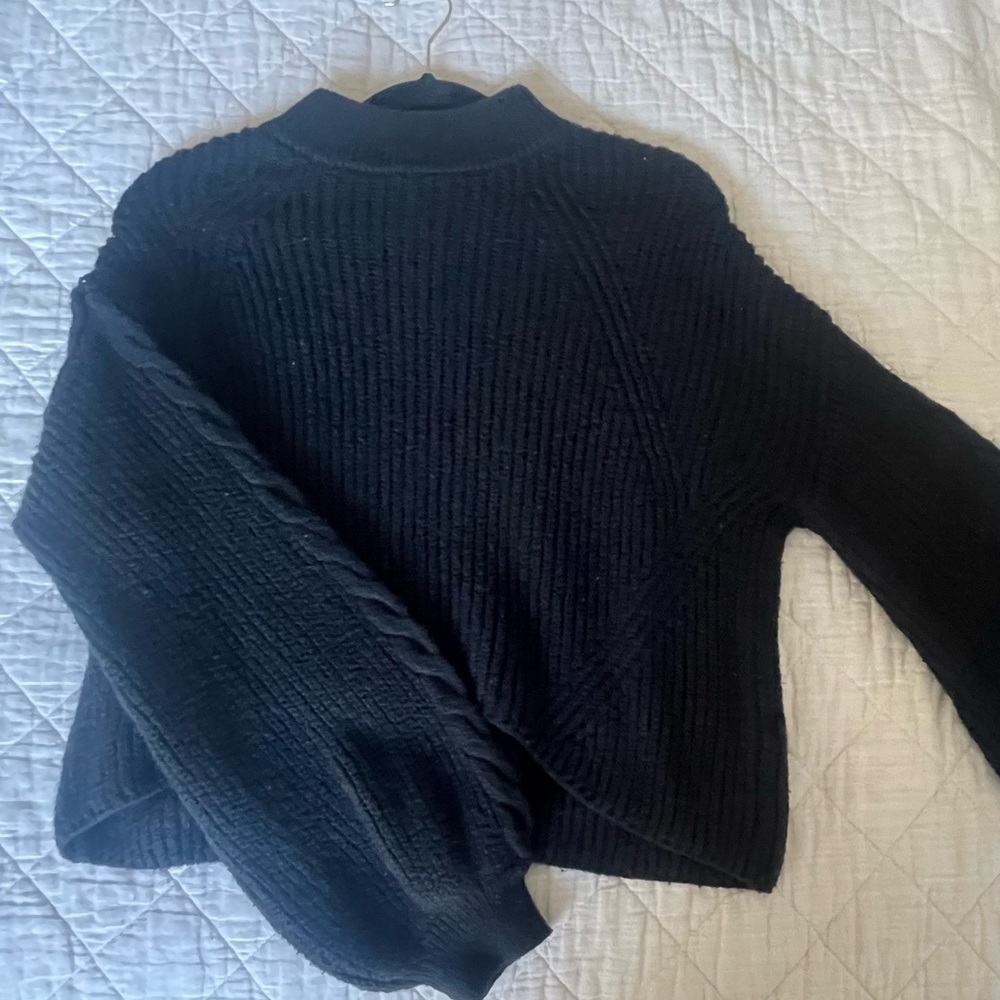 Black knitted turtle neck long sleeve sweater